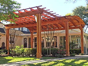 Construction Heart redwood beams and timbers form a graceful pergola.